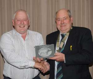 Past President Andy O Donoghue accepting presentation from current President Michael Mc Keon